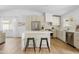 Modern kitchen with light cabinetry, stainless steel appliances, and a functional island with seating at 6351 E Waltann Ln, Scottsdale, AZ 85254