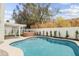 Backyard featuring a sparkling pool, hot tub, covered patio, and lush landscaping offers a private oasis for relaxation and recreation at 6351 E Waltann Ln, Scottsdale, AZ 85254