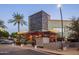 Exterior view of Postino Restaurant with string lights and a modern design creating an inviting atmosphere at 6351 E Waltann Ln, Scottsdale, AZ 85254