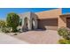 Charming home featuring a front yard, arched entry, desert landscaping, and a two-car garage at 650 E Myrtle Pass, Queen Creek, AZ 85140