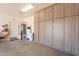 Garage featuring wall storage and a utility area at 650 E Myrtle Pass, Queen Creek, AZ 85140