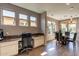 View of a built-in office space leading to the dining room with large windows and a sliding glass door at 650 E Myrtle Pass, Queen Creek, AZ 85140