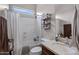 Bathroom featuring a shower and tub combination, white fixtures, and a large vanity at 6694 S Banning St, Gilbert, AZ 85298