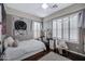 Bedroom featuring bright natural light, neutral paint, and a vanity at 6694 S Banning St, Gilbert, AZ 85298