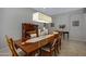Elegant dining room with a large wooden table and seating for eight at 6694 S Banning St, Gilbert, AZ 85298