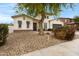 This lovely single-Gathering home offers a charming stone accent and drought-resistant landscaping at 6694 S Banning St, Gilbert, AZ 85298