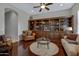 Living room showcasing custom built-in shelving and comfortable seating around a round glass table at 6694 S Banning St, Gilbert, AZ 85298
