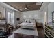 Primary bedroom with hardwood floors, a tray ceiling, and plenty of natural light at 6694 S Banning St, Gilbert, AZ 85298