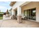 Outdoor patio features an outdoor kitchen with stone accents and cozy seating at 6694 S Banning St, Gilbert, AZ 85298