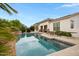 Relaxing backyard oasis with a refreshing swimming pool and ample lounge seating at 6694 S Banning St, Gilbert, AZ 85298
