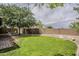 Large backyard featuring a well-maintained lawn and rock landscaping at 720 W Gail Ct, Gilbert, AZ 85233