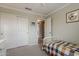 This bedroom features a neutral color palette, closet, and adjacent bathroom for a peaceful retreat at 720 W Gail Ct, Gilbert, AZ 85233