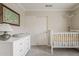 Bedroom features a dresser and crib at 720 W Gail Ct, Gilbert, AZ 85233