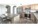 Functional kitchen features stainless steel appliances, a breakfast bar, and modern finishes at 720 W Gail Ct, Gilbert, AZ 85233