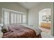 Inviting main bedroom with a king-size bed and an en-suite bathroom at 720 W Gail Ct, Gilbert, AZ 85233