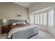 Spacious main bedroom with vaulted ceiling, large window, and a soothing color scheme at 720 W Gail Ct, Gilbert, AZ 85233