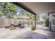 Covered patio with stone flooring, outdoor seating, and pool view at 720 W Gail Ct, Gilbert, AZ 85233