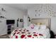Cozy bedroom with a plush bed, decorative wall art and decor, and plenty of natural light at 7424 W Pioneer St, Phoenix, AZ 85043
