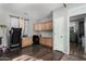 Bright home office space with custom built-in shelving and a treadmill at 7424 W Pioneer St, Phoenix, AZ 85043