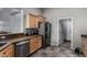 Well-equipped kitchen with stainless steel appliances, wooden cabinetry, and plenty of counter space at 7424 W Pioneer St, Phoenix, AZ 85043