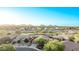 This aerial view showcases the community, mountains in the distance, and desert landscapes at 766 E Taylor Trl, San Tan Valley, AZ 85143