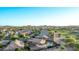 Panoramic aerial view of a residential community with mountain views and a pool at 766 E Taylor Trl, San Tan Valley, AZ 85143