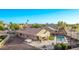 Aerial view of backyard including the pool, hot tub, patio, and landscaping at 766 E Taylor Trl, San Tan Valley, AZ 85143