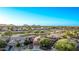 This aerial view highlights the community and desert landscapes with the beautiful mountain views in the distance at 766 E Taylor Trl, San Tan Valley, AZ 85143