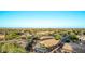 Expansive aerial view of a desert community, featuring homes with a pool and covered patio at 766 E Taylor Trl, San Tan Valley, AZ 85143