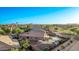 Aerial view of a home with a pool, covered patio, and manicured landscaping at 766 E Taylor Trl, San Tan Valley, AZ 85143