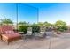 Backyard patio with comfortable seating around the pool at 766 E Taylor Trl, San Tan Valley, AZ 85143
