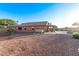 Expansive backyard with a covered patio, hot tub, fire pit, and pool, perfect for outdoor fun and relaxation at 766 E Taylor Trl, San Tan Valley, AZ 85143