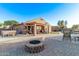 Backyard featuring a fire pit, hot tub, covered patio, and pool at 766 E Taylor Trl, San Tan Valley, AZ 85143
