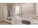 Bright bathroom features a tub, separate shower, and white countertops at 766 E Taylor Trl, San Tan Valley, AZ 85143