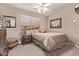 Cozy bedroom features neutral walls, ceiling fan, and carpet floors at 766 E Taylor Trl, San Tan Valley, AZ 85143