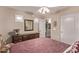 Bedroom with carpet, traditional wood furniture, and double door entry at 766 E Taylor Trl, San Tan Valley, AZ 85143