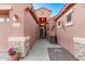 Inviting walkway to the front door, accentuated by stone accents and decorative outdoor features at 766 E Taylor Trl, San Tan Valley, AZ 85143