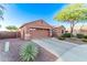 Inviting single-story home with a two-car garage and a beautifully landscaped front yard at 766 E Taylor Trl, San Tan Valley, AZ 85143