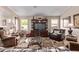 Warm and inviting living room with comfortable seating and a large entertainment center at 766 E Taylor Trl, San Tan Valley, AZ 85143