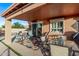 Covered patio with comfortable seating and an outdoor dining area at 766 E Taylor Trl, San Tan Valley, AZ 85143