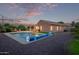 Beautiful backyard featuring a refreshing pool, covered patio, and well-maintained landscaping, great for outdoor activities at 766 E Taylor Trl, San Tan Valley, AZ 85143