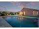 Enjoy the Arizona sunsets from your private pool, complete with lounge chairs, a covered patio, and mature landscaping at 766 E Taylor Trl, San Tan Valley, AZ 85143