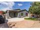 This backyard offers a patio, synthetic grass, a firepit, and a low-maintenance landscape, perfect for outdoor activities at 81 E Rock Wren Dr, San Tan Valley, AZ 85143