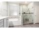 Bright bathroom featuring a soaking tub, a frameless glass shower and tile surround at 81 E Rock Wren Dr, San Tan Valley, AZ 85143