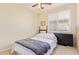 This bedroom has neutral colored walls and carpet, plus a window with wooden blinds at 81 E Rock Wren Dr, San Tan Valley, AZ 85143