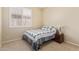 This cozy bedroom has natural light from the window and is carpeted at 81 E Rock Wren Dr, San Tan Valley, AZ 85143