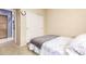 A carpeted bedroom featuring a twin bed with gray blanket, closet with sliding doors, and neutral paint at 81 E Rock Wren Dr, San Tan Valley, AZ 85143