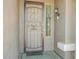 Front door with security screen and sidelight to add a unique appeal to your entryway at 81 E Rock Wren Dr, San Tan Valley, AZ 85143
