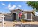 Charming single-story home featuring a well-manicured desert landscape and a two-car garage at 81 E Rock Wren Dr, San Tan Valley, AZ 85143
