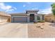 Beautiful one-story home boasting a desert landscape, a two-car garage, and a large driveway at 81 E Rock Wren Dr, San Tan Valley, AZ 85143